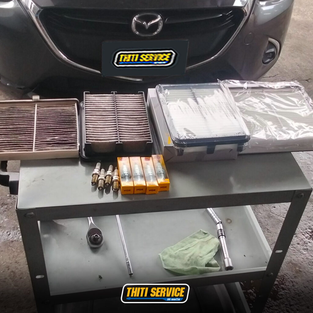ธิติเซอร์วิส - อู่ซ่อมรถยนต์ กาญจนบุรี-ปิดระบบ i stop-เปลี่ยนหัวเทียน-mazda2-2-2