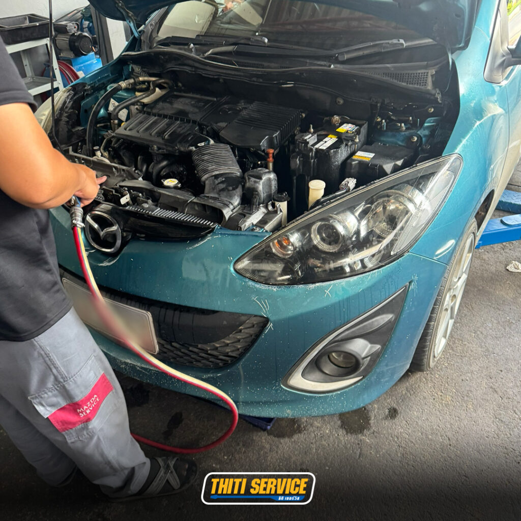ธิติเซอร์วิส - อู่ซ่อมรถยนต์ กาญจนบุรี-เปลี่ยนปีกนกหน้า-โช๊คอัพหน้า-mazda2-2-1